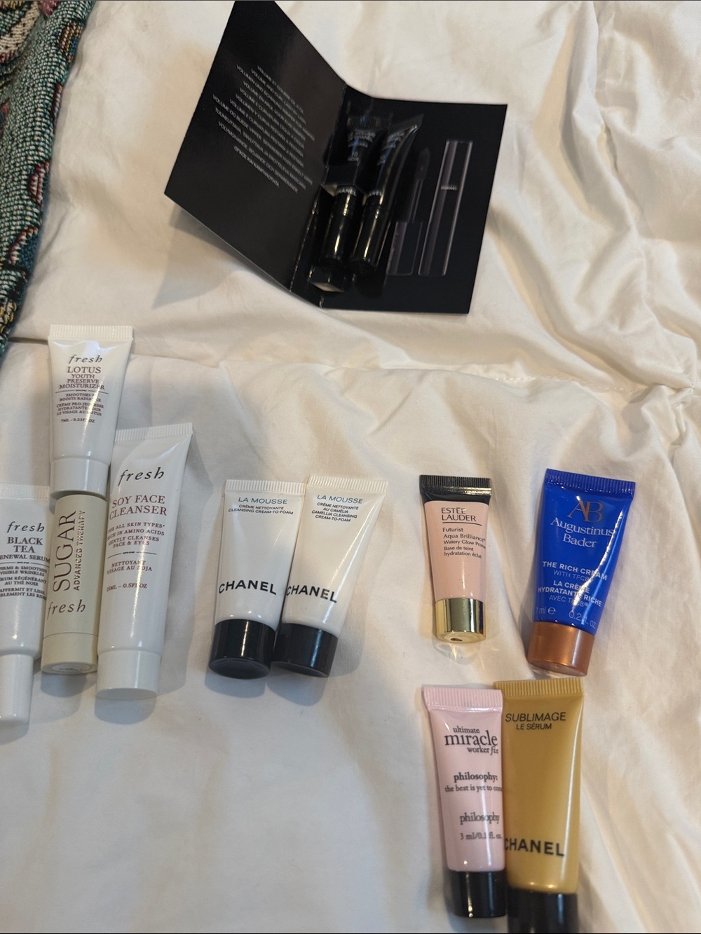 Grouping of high-end makeup samples in Chanel, fresh, Augustinus Badar.